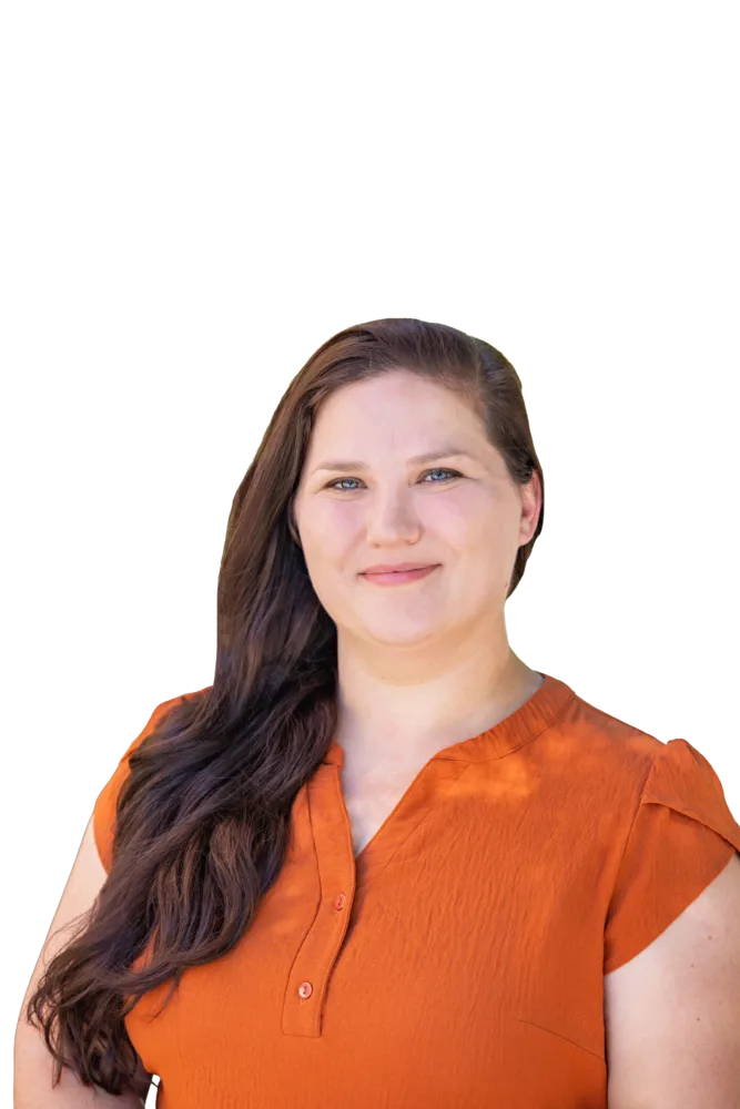 Portrait of a smiling woman with long brown hair wearing an orange blouse