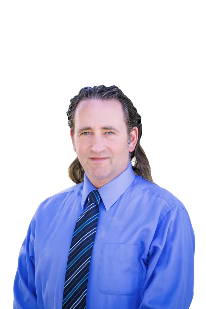 Portrait of a man with long brown hair wearing a blue dress shirt and striped tie