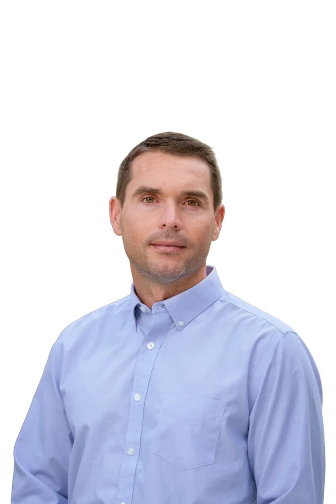 Man in a light blue button-down shirt facing the camera