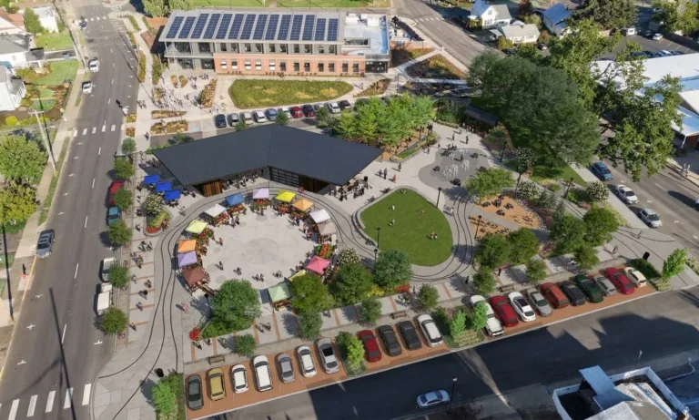 Architectural rendering of a sunny community park with curving paths, benches, lampposts, and lush landscaping, where people stroll near a central tree, with a pavilion and modern building in the background.
