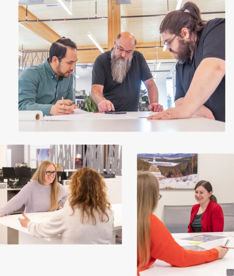 Coworkers collaborating around tables in a modern office, reviewing documents and discussing ideas in small group meetings.