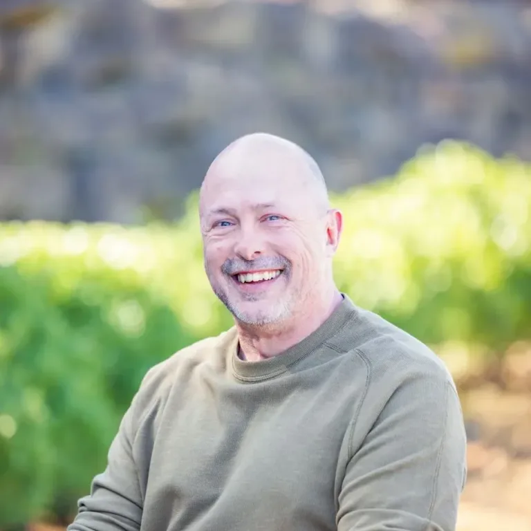 Edward Hodges, male engineer in green sweater