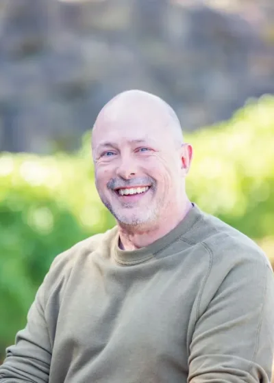 Edward Hodges, male engineer in a green sweater