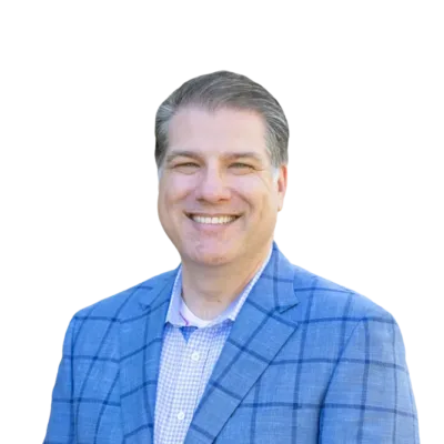 Smiling man in a blue plaid blazer and checkered shirt