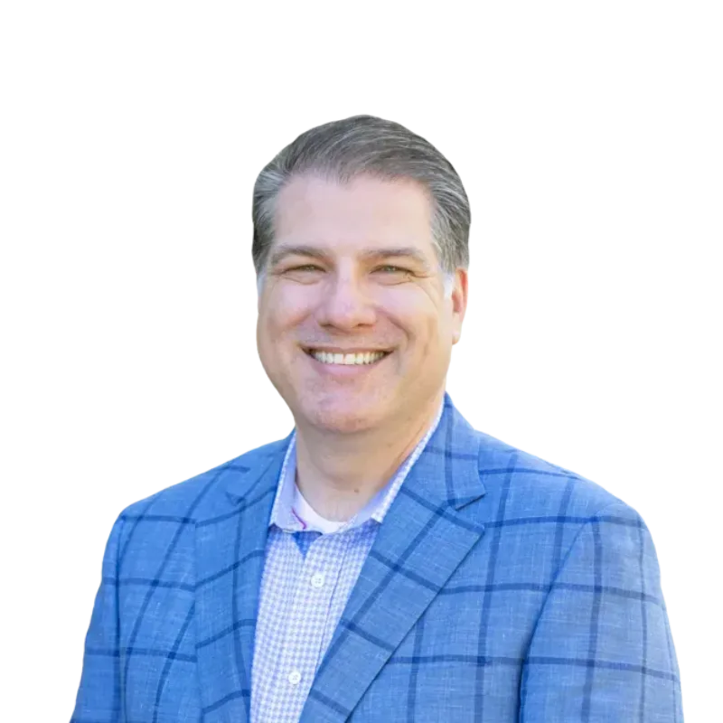 Smiling man in a blue plaid blazer and checkered shirt