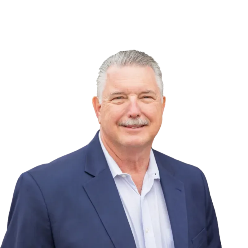Middle-aged man with gray hair and a mustache wearing a navy blazer and light shirt