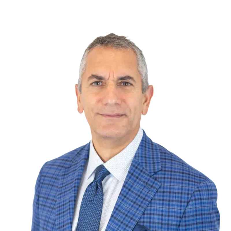 Man wearing a blue plaid suit, white shirt, and patterned tie