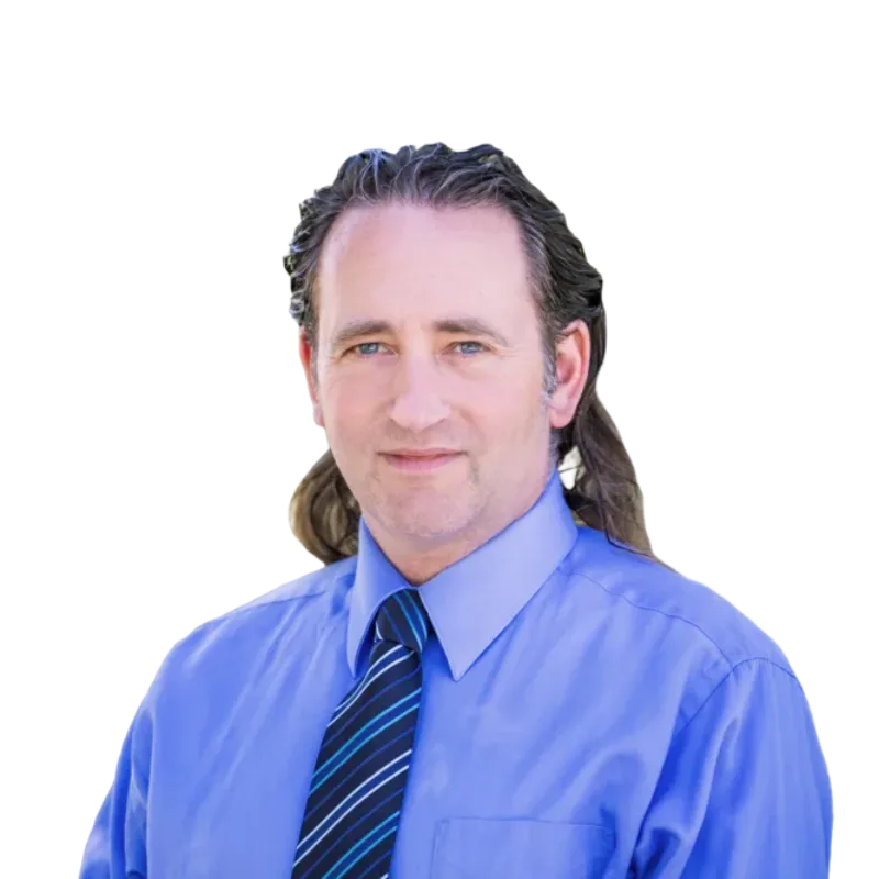 Portrait of a man with long brown hair wearing a blue dress shirt and striped tie