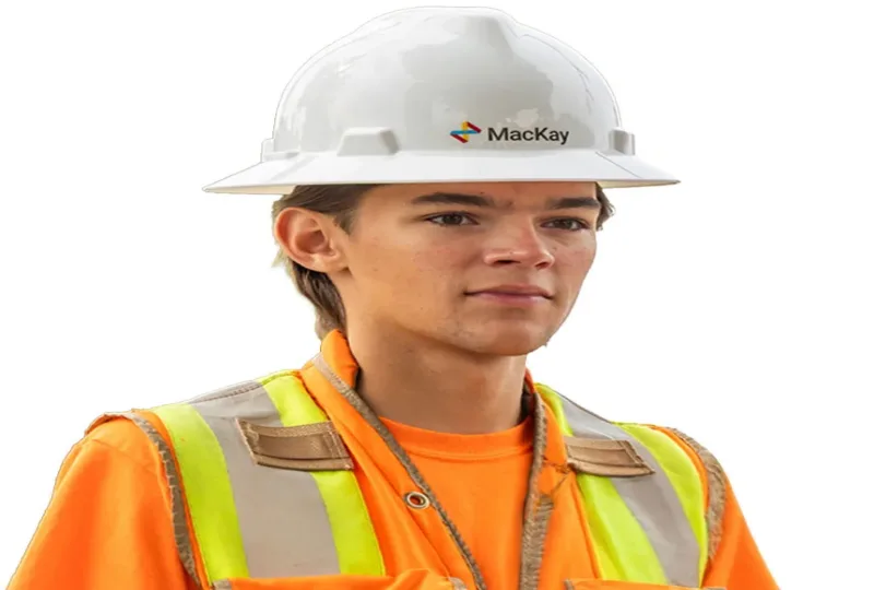 Construction worker wearing a white MacKay hard hat and high-visibility orange safety vest